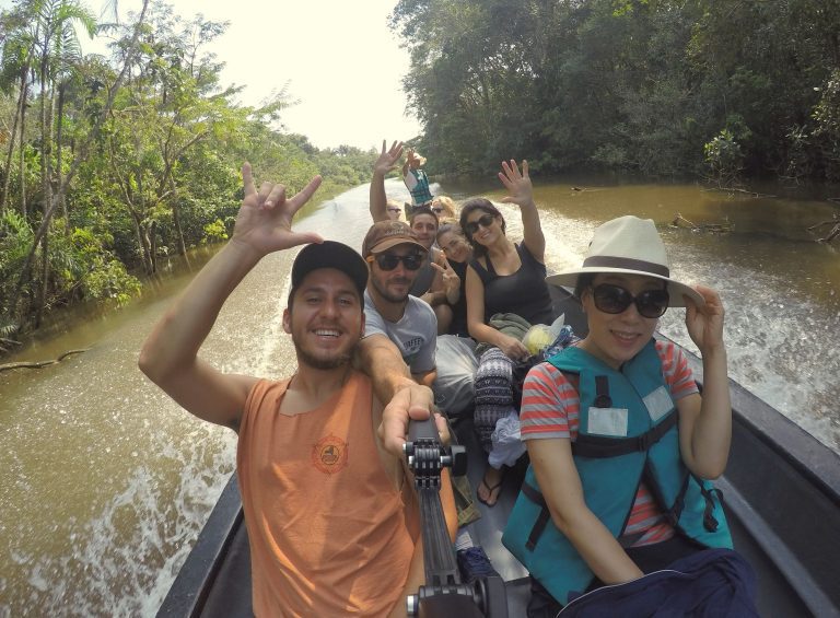 Tourists in the Cuyabeno River on their way to Laguna Grande